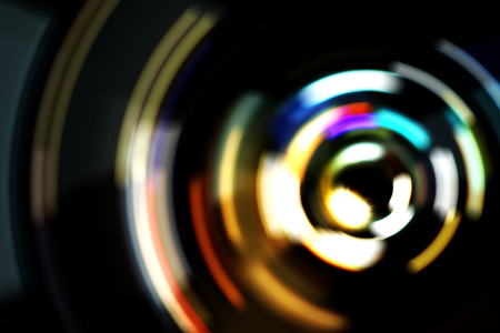 Real Light blur bokeh in dark background from lens out focus. Red blue green yellow light neon at bar.it look like circle light many color blur at night on street in big city in celebration timeの写真素材