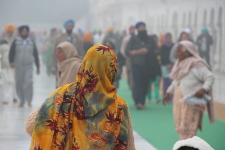 Colorful Indian shawl to a woman. India.の写真素材