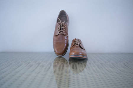 a pair of brown shoesの写真素材