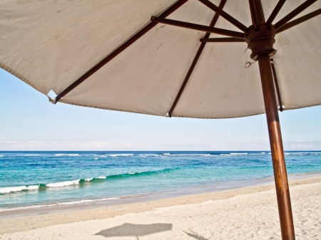 Bali beach with beach umbrellaの写真素材