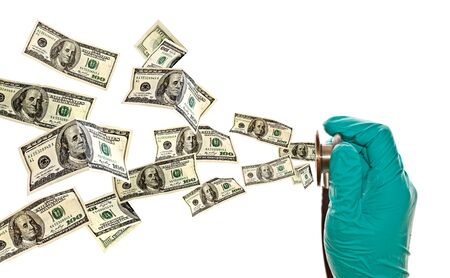 doctor s hand holding stethoscope and flying US dollar banknotes on white background
