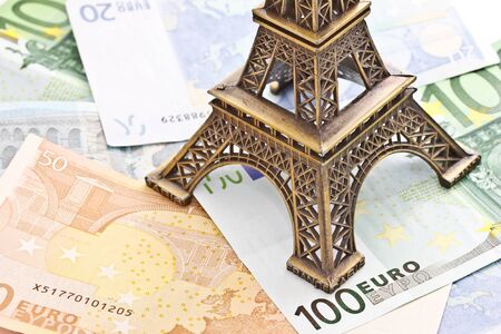 Eiffel tower model with Euro banknotesの写真素材