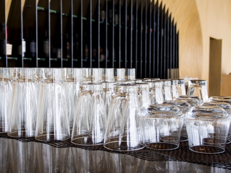 different sizes of glasses in a hotel bar