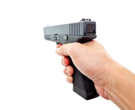 hand aiming hand gun on white backgroundの写真素材