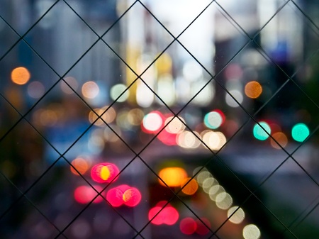 colorful bokeh in the city with gridの写真素材