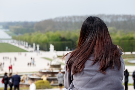 Asain lady at the garden of Versailles palace, France の写真素材