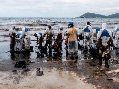 oil spilled beach operation in Rayong, Thailand on July 31, 2013