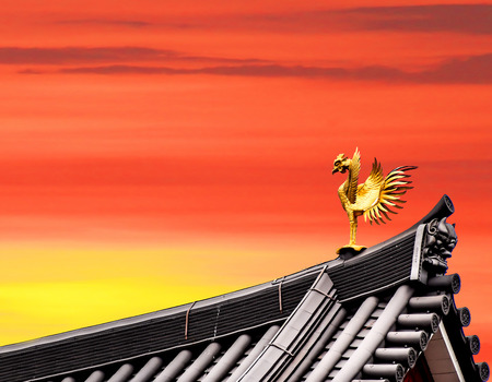 Japanese phoenyx image at the roof top with dusk skyの写真素材