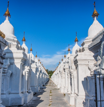 white stupa in Kuthodaw temple, Mandalay, Myanmarの写真素材
