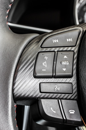 car audio control switch on steering wheelの写真素材