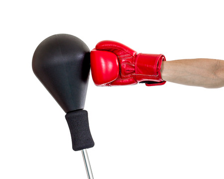 hand with glove punch a punching ball on white backgroundの写真素材