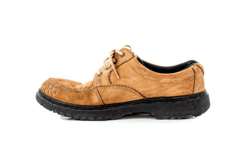 old brown leather shoe on white backgroundの写真素材