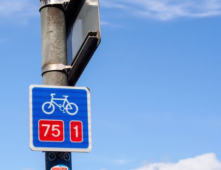 bicycle lane sign with blue skyの写真素材