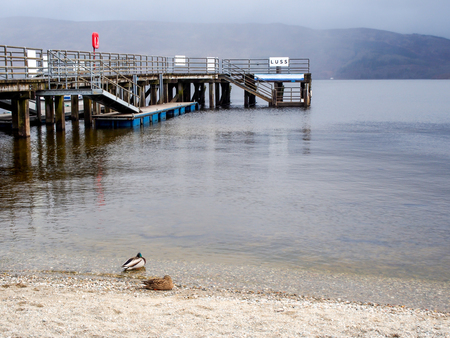 beautiful pier at Luss village, Scotland, UKの写真素材