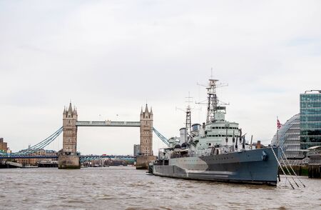 HMS Belfast with The Tower Bridge in Thames river, London, UKのeditorial素材