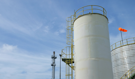 Chemical tank with blue skyの写真素材
