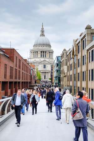 tourists at Millenium bridge in front of St. Paul cathedral, London, UKのeditorial素材