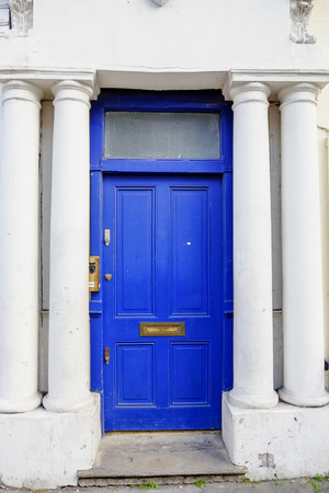 blue door at Notting Hill, London, UKの写真素材