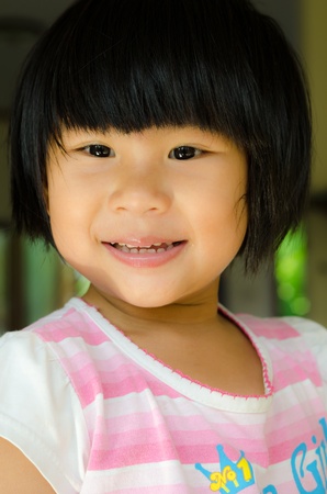 Happy asian girl smile on her faceの写真素材
