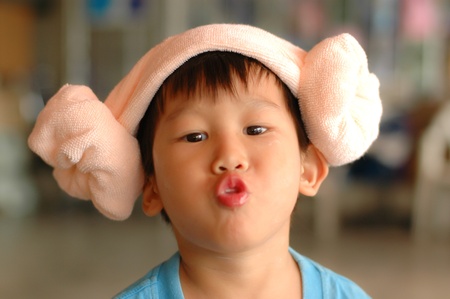 Asian boy with funny towel hat