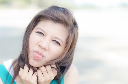 Happy woman with a naughty wink outdoor