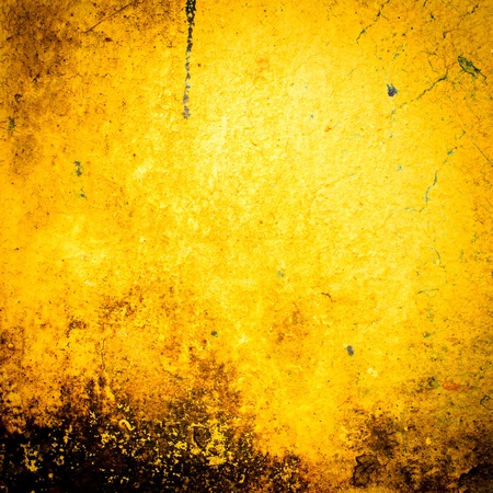 Abstract Yellow old and dirty wall backgroundの写真素材