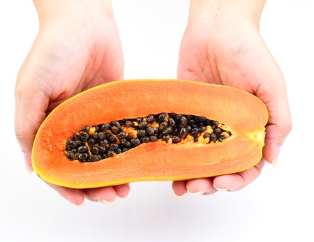 Hand holding Papaya on white backgroundの写真素材