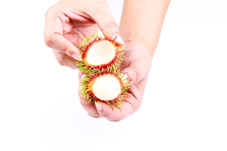 Rambutans on the handの写真素材