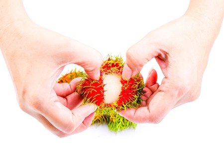 Rambutans on the handの写真素材