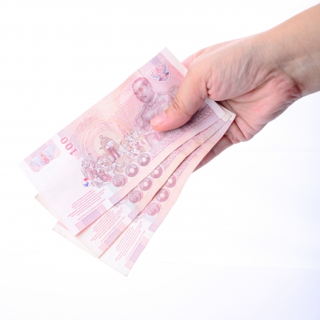 Thai money in your handの写真素材