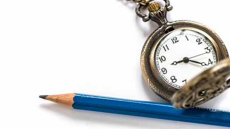 Open blank notebook with blue pencil and pocket watch on  wood backgroundの写真素材