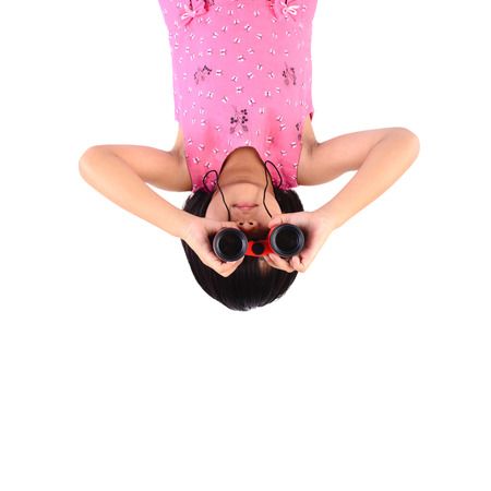 Girl with binoculars vertical on white.の写真素材