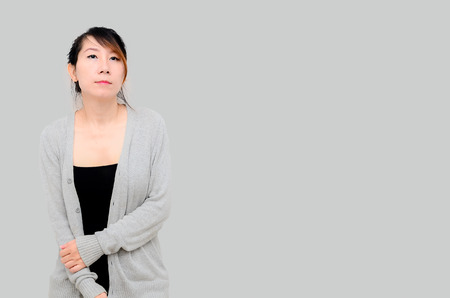 Chinese Asian woman Model wearing grey cardigan isolated.の写真素材