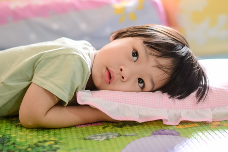 Child in bedの写真素材