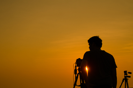 Silouette Photographer taking photo at  fisherman village in Bangtaboon, Petchaburi, Thailand