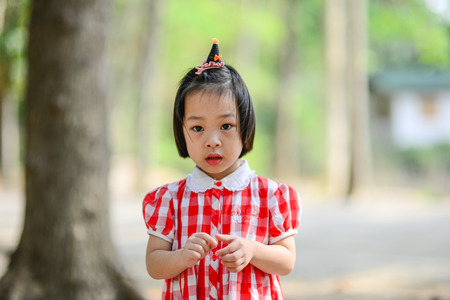 Shy Asian girl in the park outdoor.の写真素材