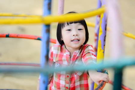 Happy Asian girl playing at playground.のeditorial素材
