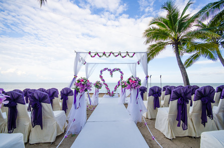 Flower decorated in heart shape in wedding ceremony which set up on the beach.の写真素材