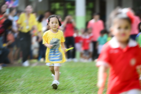 Cute Asian girl running in sport day.のeditorial素材