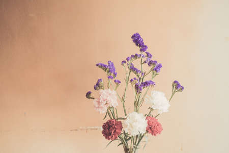 Beautiful summer flowers in vases on wooden backgroundの写真素材