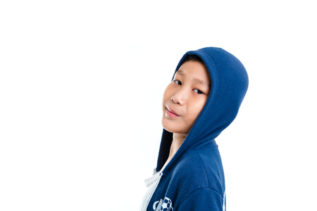 Asian boy in a hooded sweat shirtの写真素材
