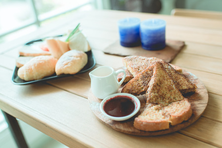 Honey toasted on wooden plate decoration in vintage style.  DOFの写真素材
