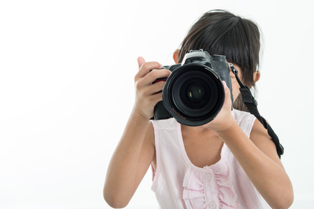 Child Holding Camera / Child Holding Camera Background / Child Holding DSLR Camera to Take Photosの写真素材