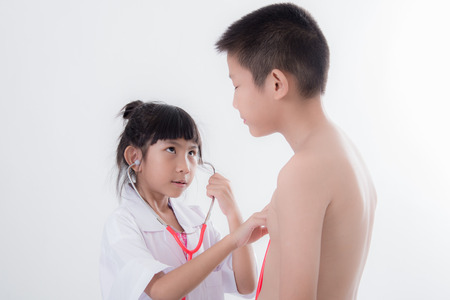 Asian young doctor and patient isolated on white.の写真素材