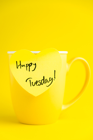 Happy Tuesday message on yellow mug.の写真素材