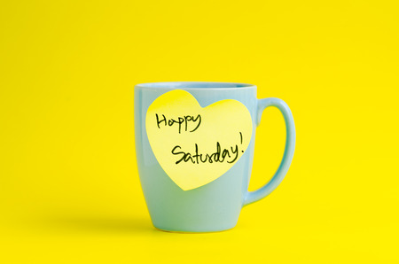 Happy Saturday message on blue pastel mug.の写真素材