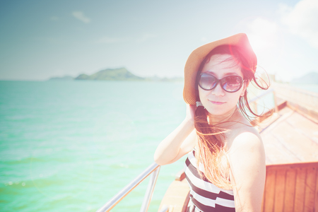 Asian woman wearing sunglasses outdoors portrait with sunny day.の写真素材