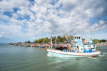 Blurry background fishing boat on oceanの写真素材