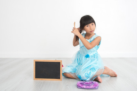 Asian girl brushing her hair at home.の写真素材