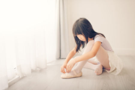 Blurry background girl in ballet dance at class.の写真素材